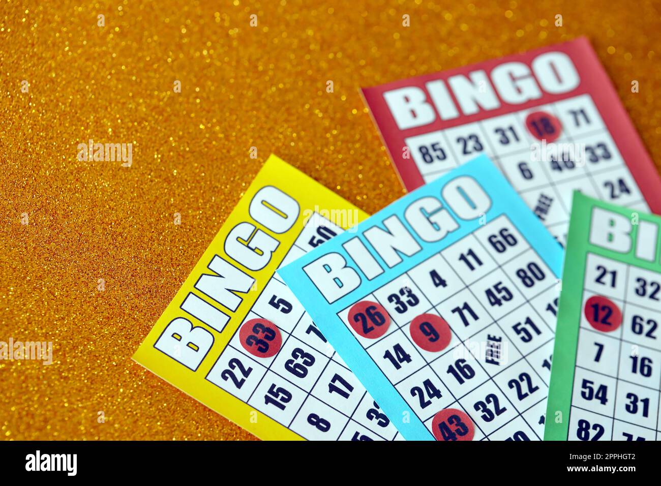 Many colorful bingo boards or playing cards for winning chips. Classic US or canadian five to five bingo cards on bright background Stock Photo