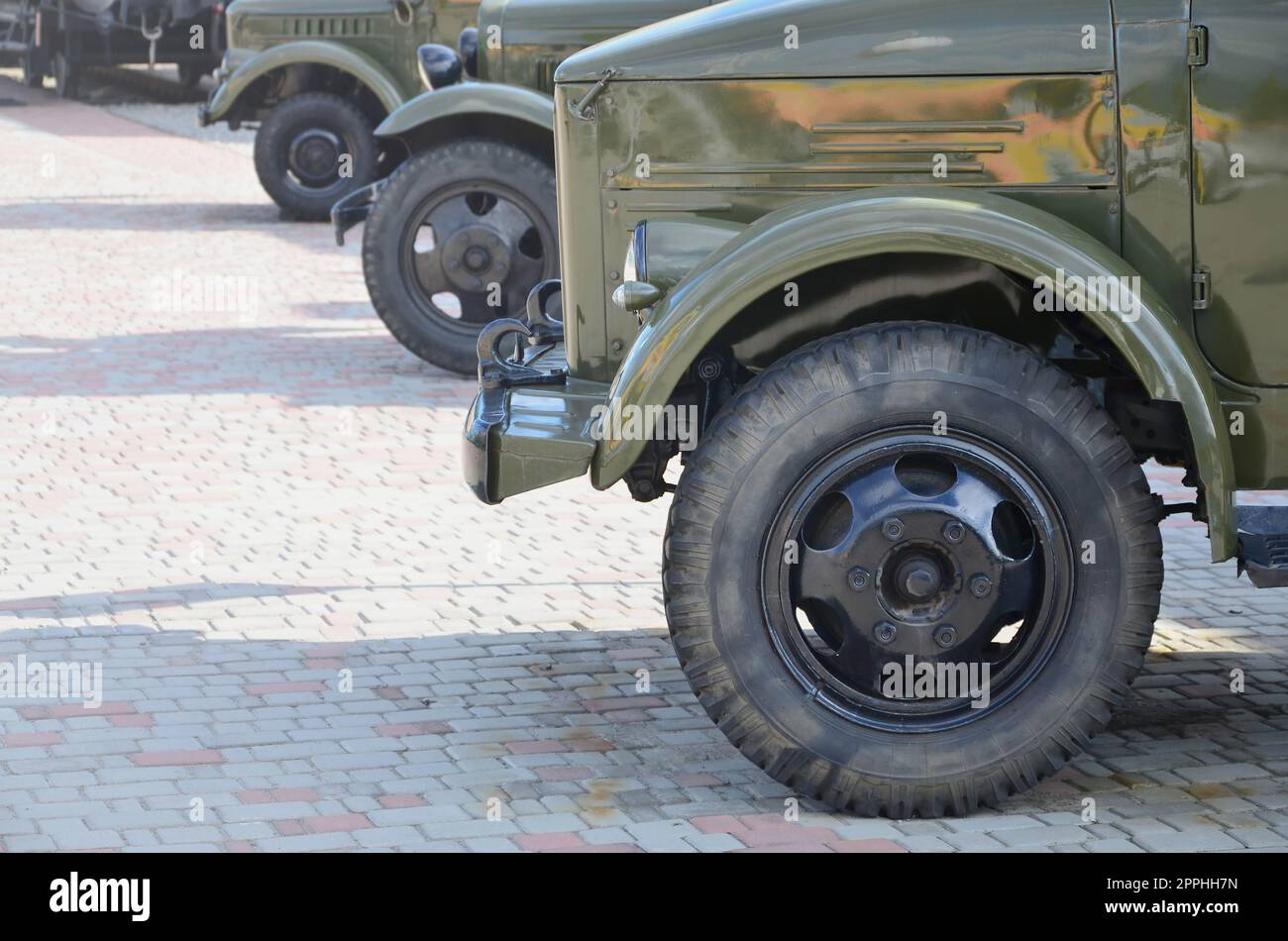Photo of the cabins of three military off-road vehicles from the times of the Soviet Union. Side view of military cars from the front wheel Stock Photo