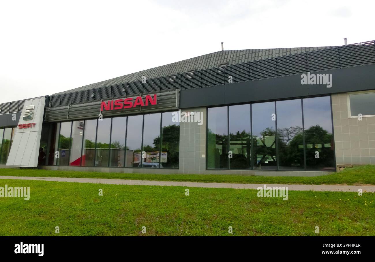 Nissan dealership sign in front of showroom store Japanese brand Stock Photo