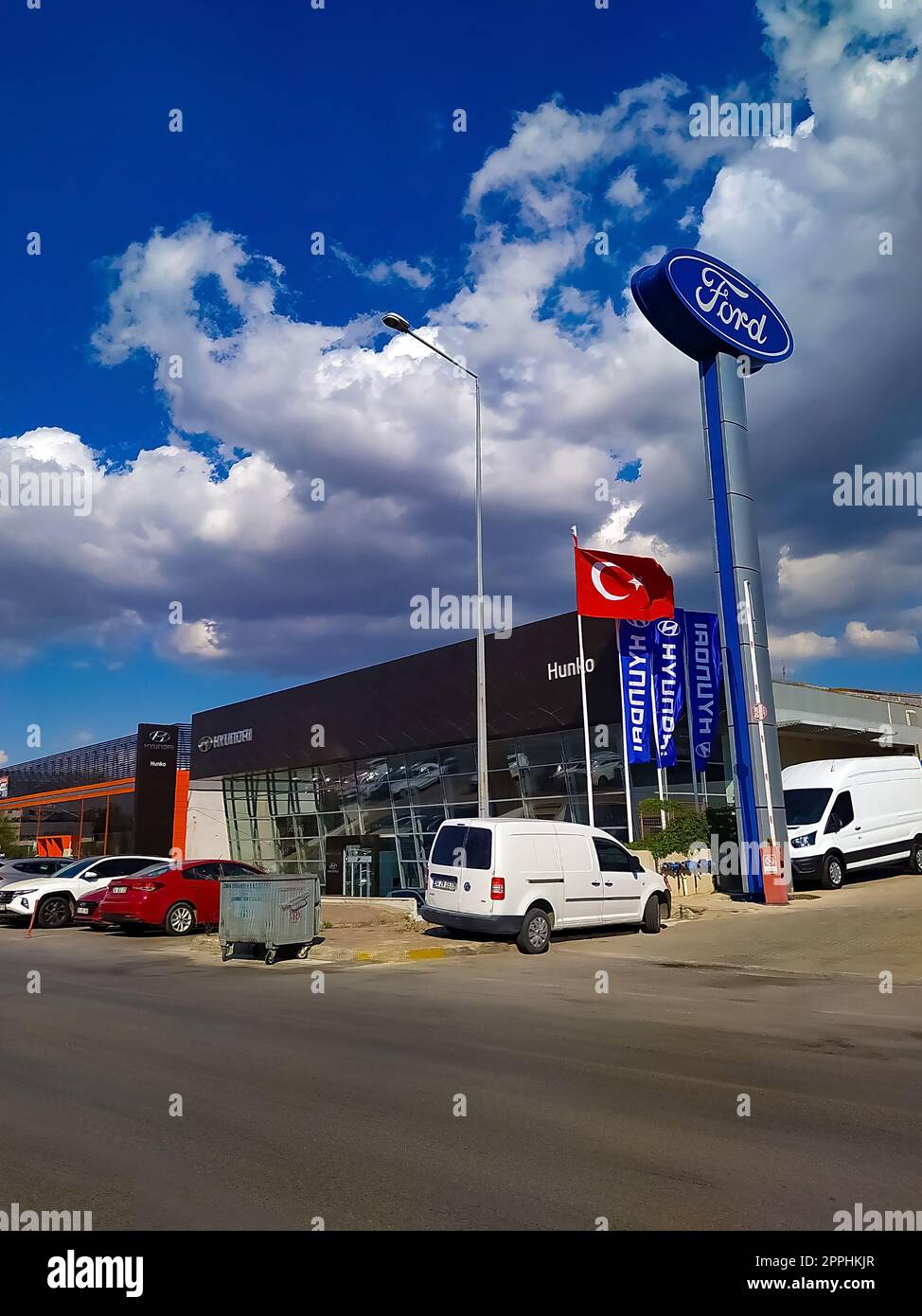 Izmir, Turkey - September 22, 2022: Ford logos on the dealership of the area, against blue sky. Stock Photo
