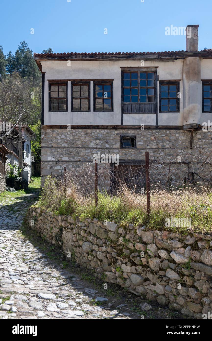 MELNIK, BULGARIA - APRIL 13, 2023: Typical street and old houses at town of Melnik, Blagoevgrad region, Bulgaria Stock Photo