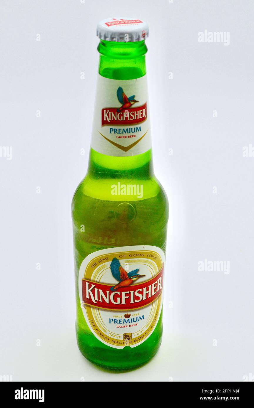 A closeup of a bottle of Kingfisher Premium lager against a white background Stock Photo