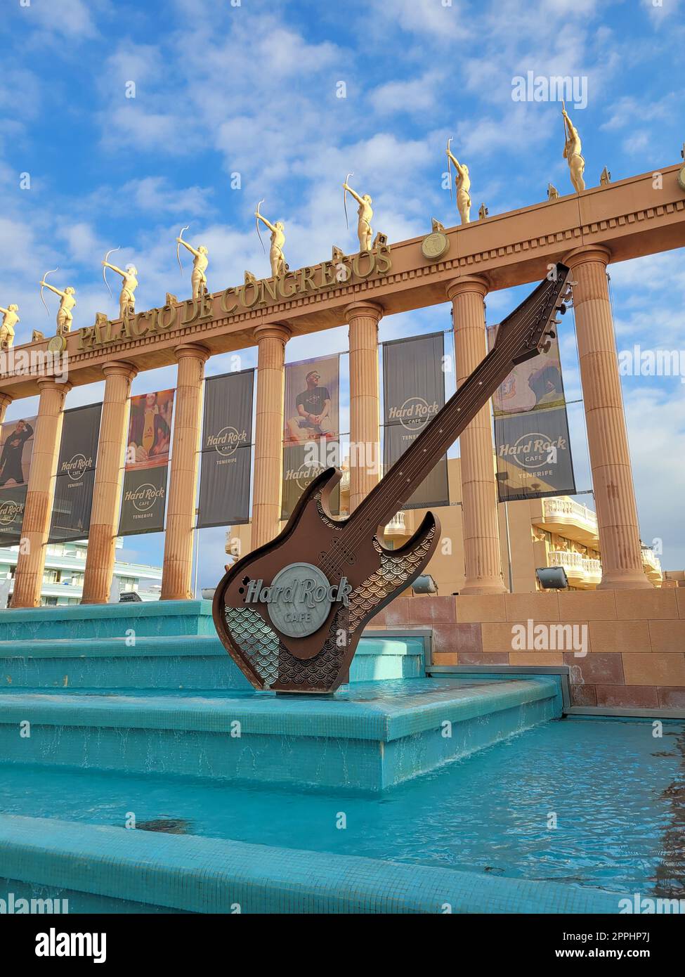 Hard Rock Cafe, Playa de la Americas, Tenerife, Spain August 12, 2022 - Building exterior with guitar , fountain and some archers Stock Photo