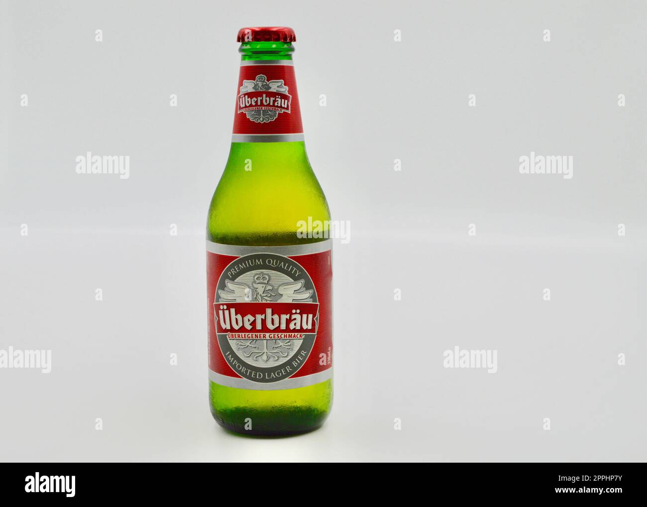 A closeup of a bottle of Uberbrau Premium lager against a white background Stock Photo