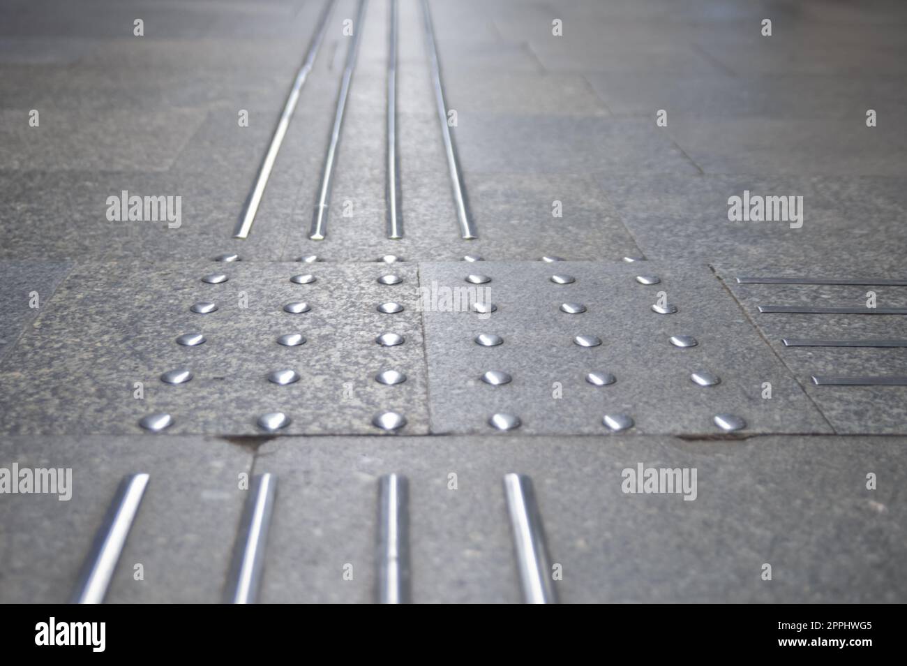 Floor tiles with tactile ground surface indicators, closeup view Stock