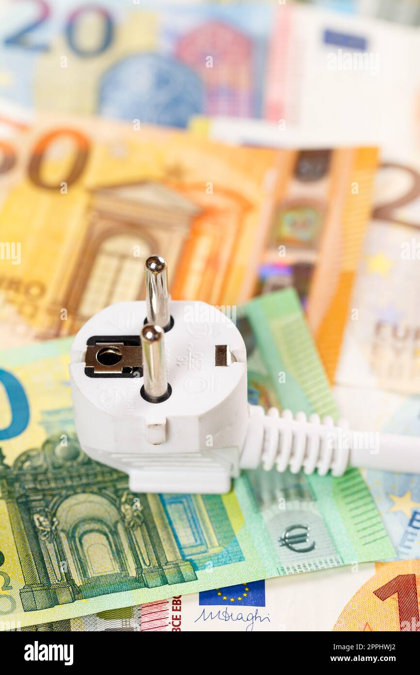 Cost of energy price of electricity symbolic photo with power cord mains cable portrait format Stock Photo