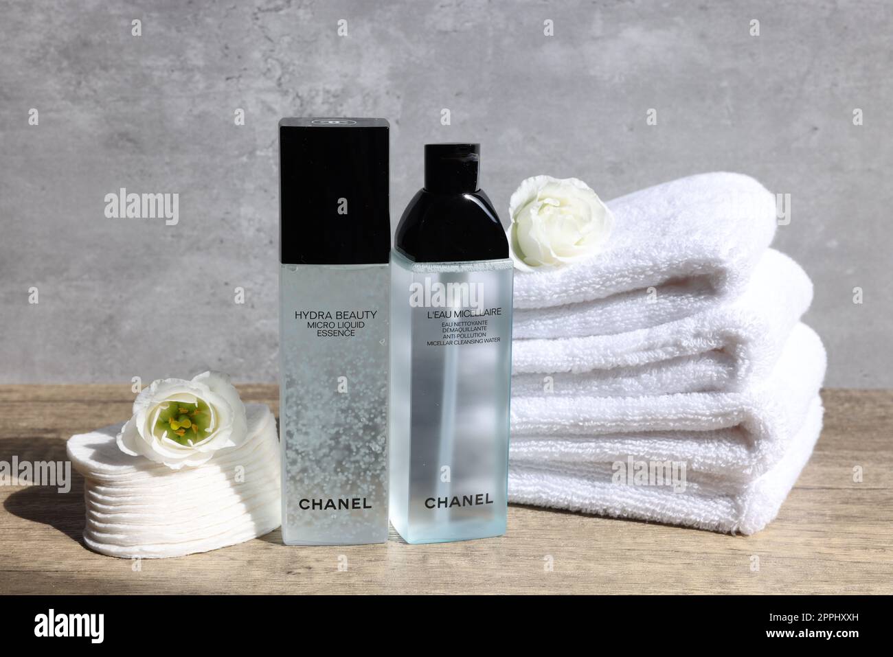 Leiden, Netherlands - July 14, 2022: Chanel cosmetic products, cotton pads  and stacked towels on wooden table Stock Photo - Alamy