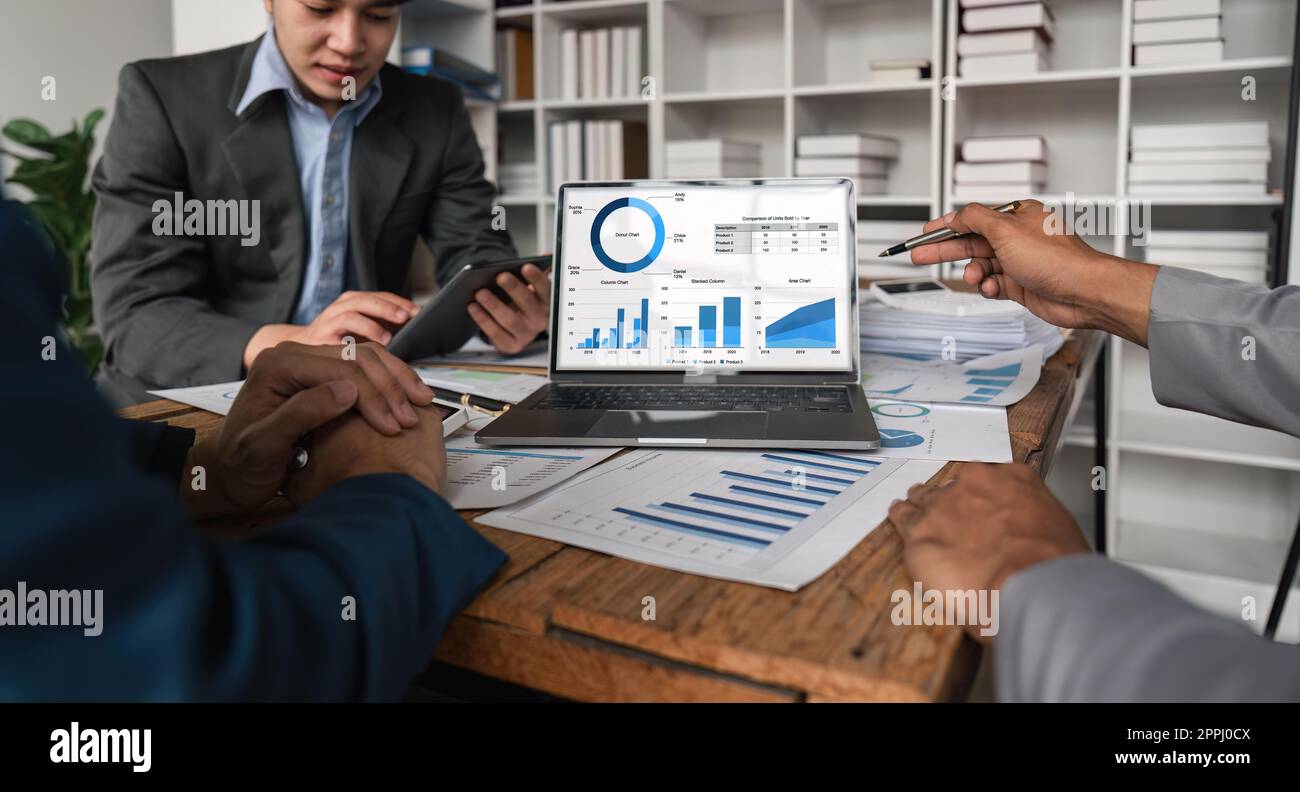 Business team analyzing income charts and graphs with laptop computer ...