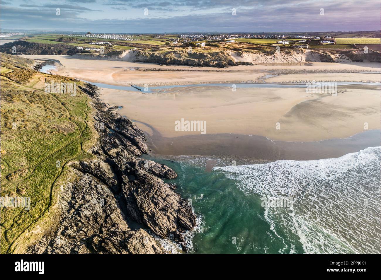 A spectacular aerial view of Crantock Beach and the tidal Gannel river in Newquay in Cornwall in England in the UK. Stock Photo