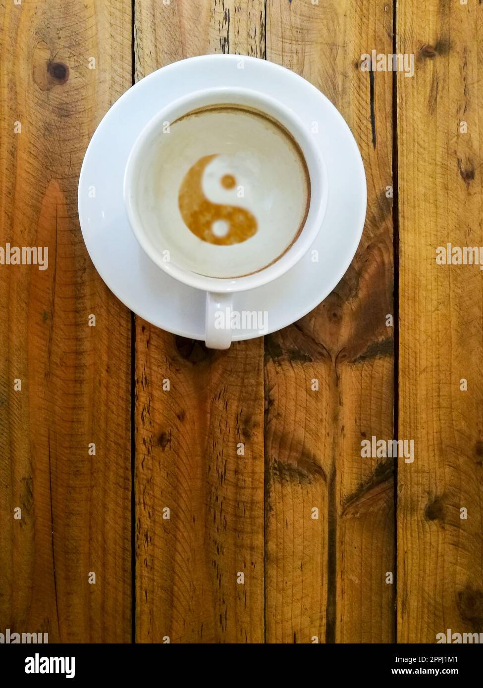 empty cup of coffee as a symbol of yin yang, after drink Stock Photo Alamy