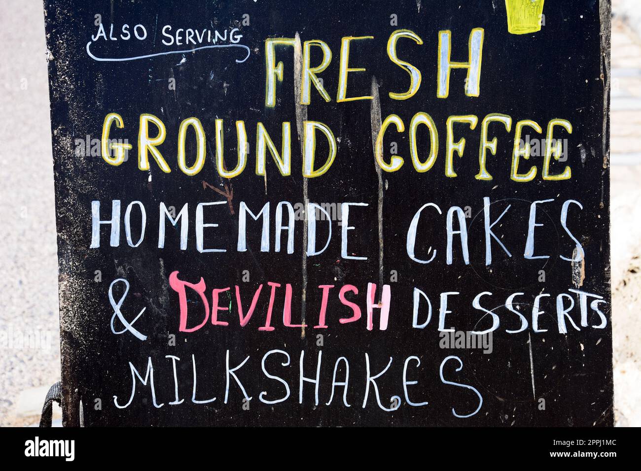 Chalkboard advertising coffee, milkshakes and cakes along the promenade, Lyme Regis, Dorset, UK, Europe Stock Photo