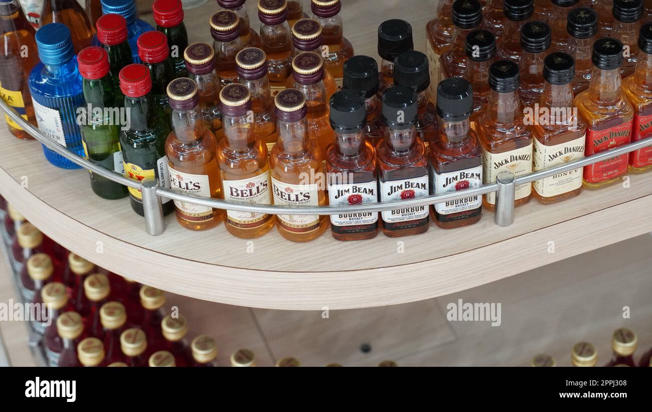 Ben Gurion airport, Israel  - October 08, 2022:  Small alcohol bottles - Jack Daniels whiskey, Jim Beam. Stock Photo