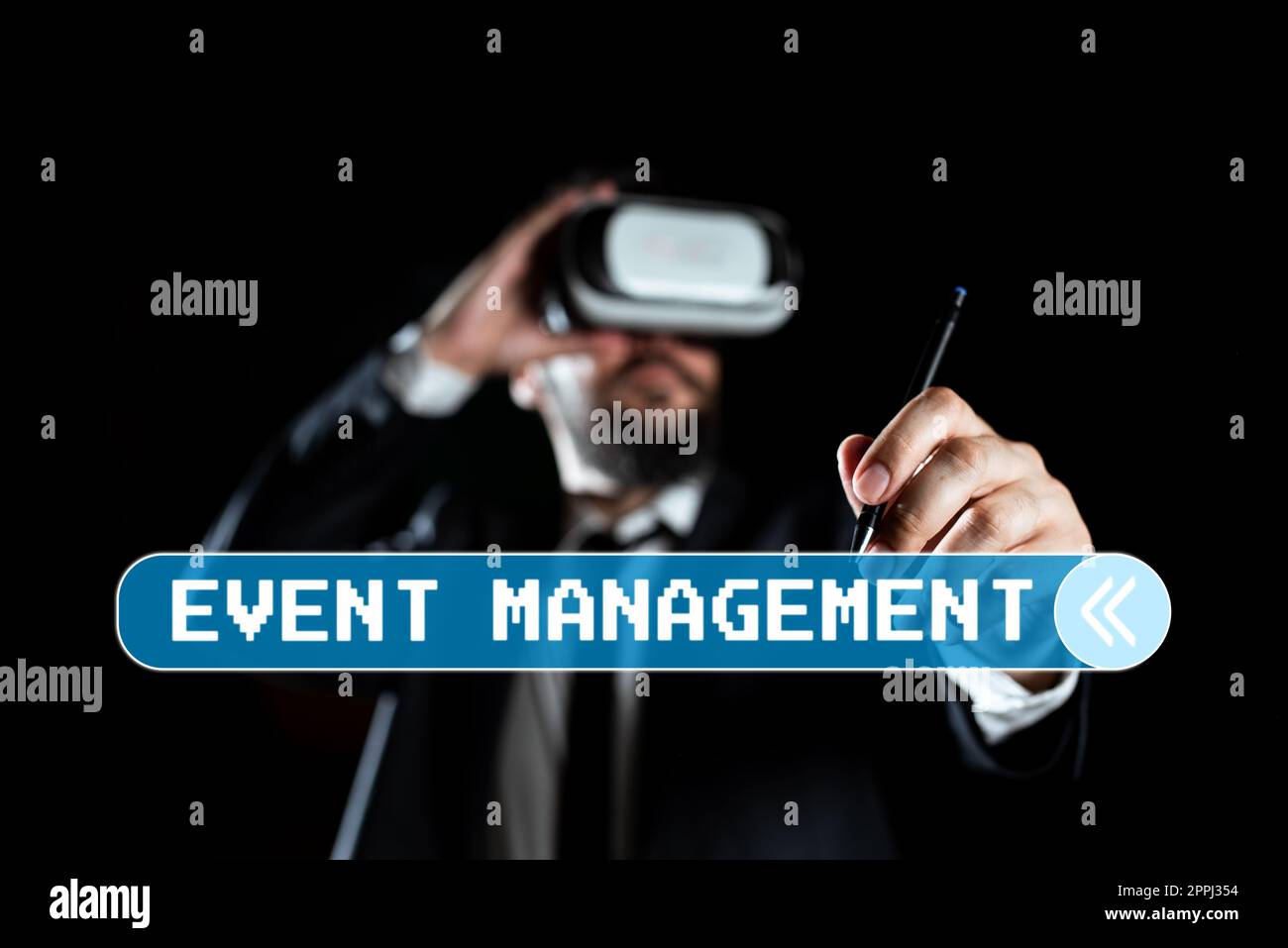 Conceptual display Event Management. Word Written on everything that happens is part of a bigger picture Man Wearing Virtual Reality Simulator Holding Pen During Training. Stock Photo
