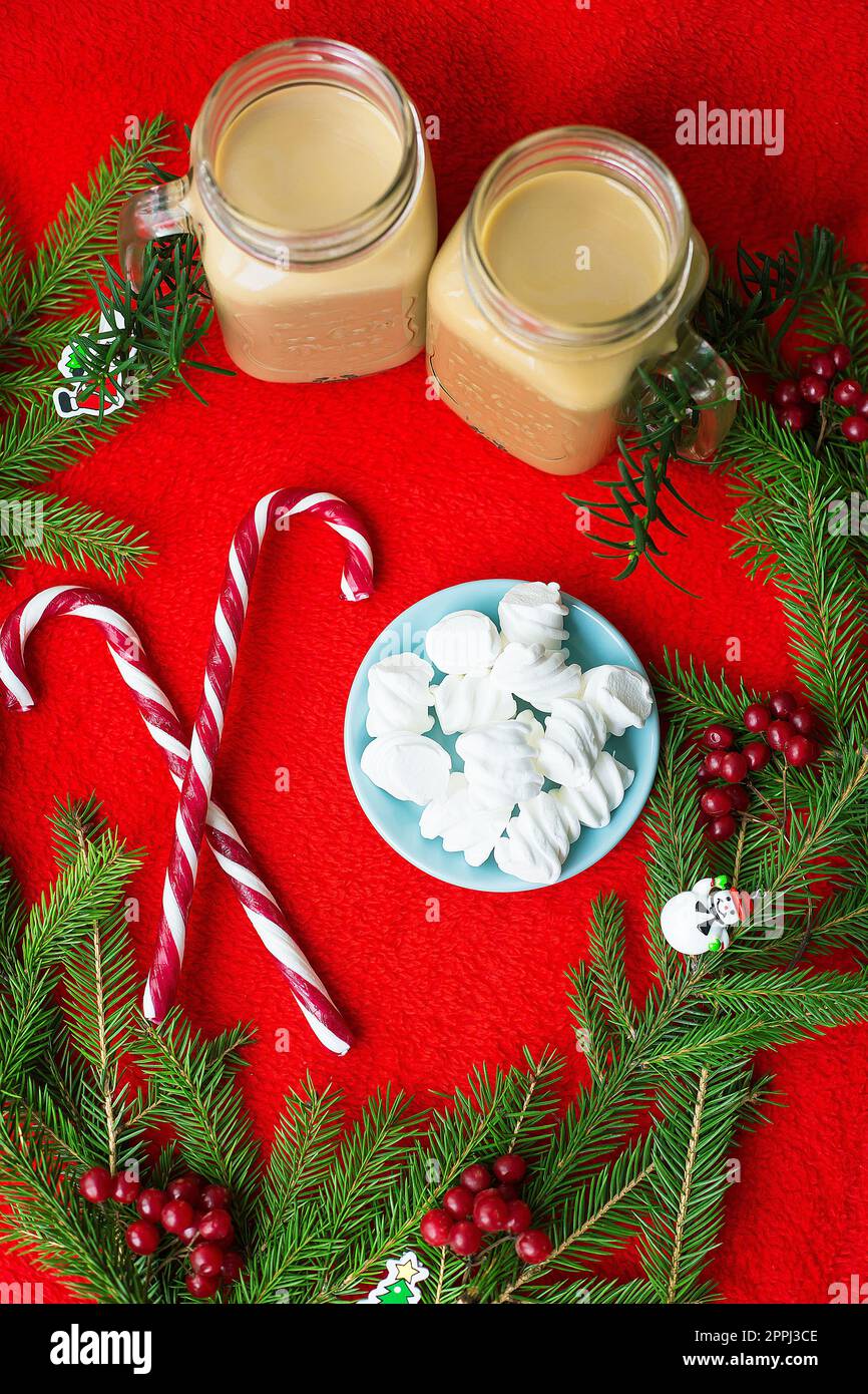 Christmas tree, candy, coffee marshmellou on a red background. Happy New Year Stock Photo