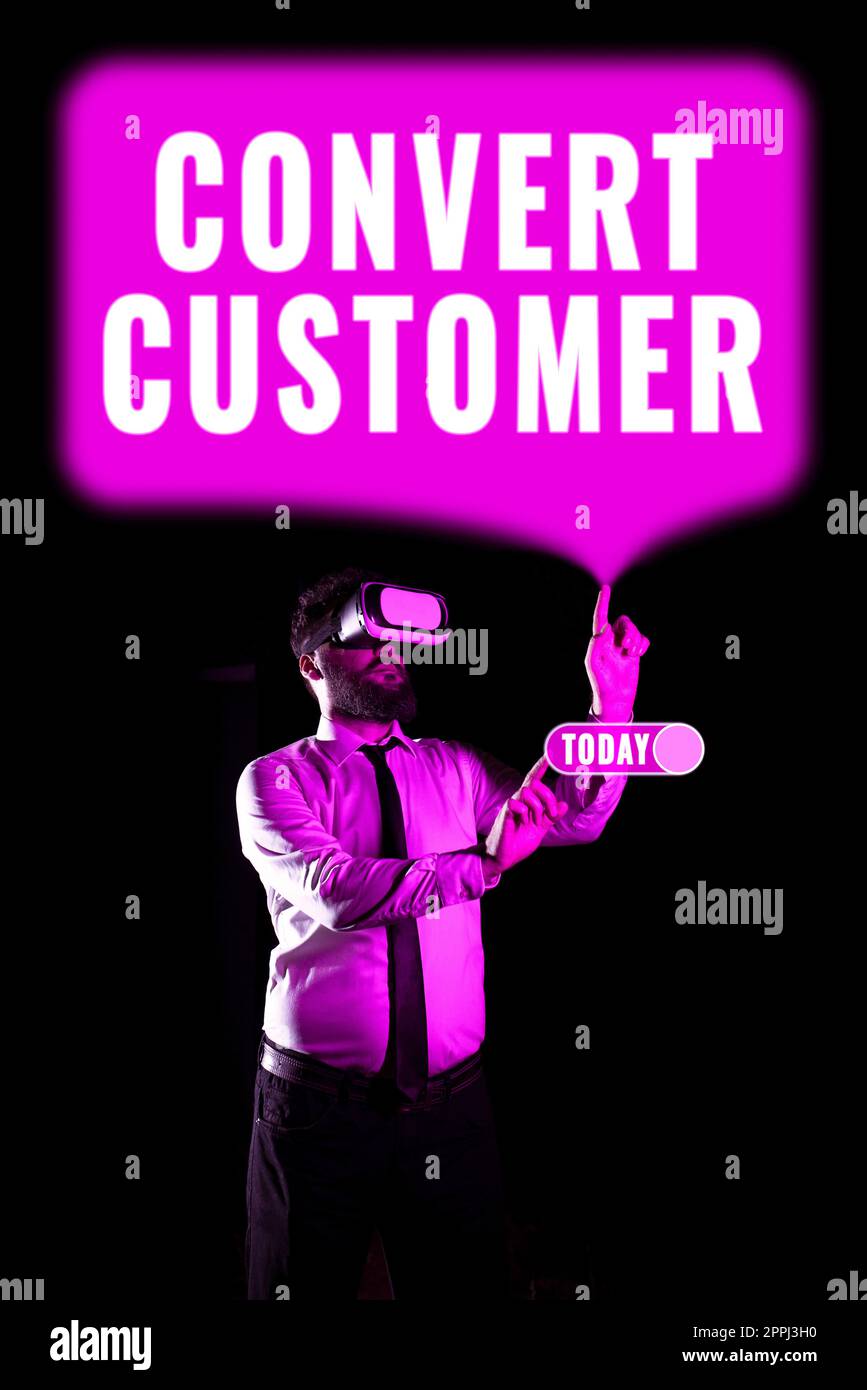 Hand writing sign Convert Customer. Business overview someone who works obediently for another person in company Businessman Using Virtual Reality Simulator And Gesturing During Training. Stock Photo