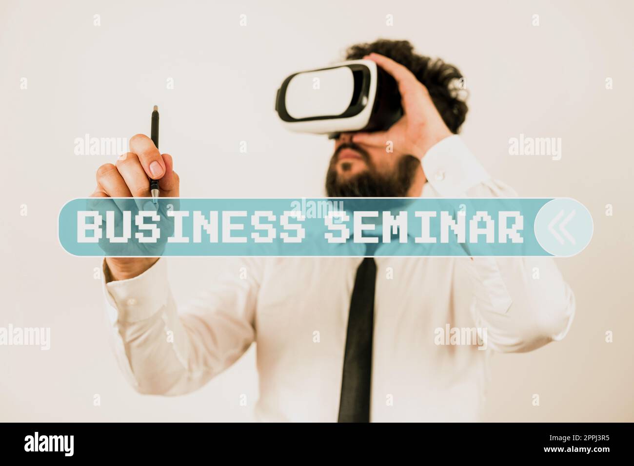 Hand writing sign Business Seminar. Business overview Educators that train students about business concepts Standig Man Holding Pen To Point Important Messages And Wearing Vr Glasses. Stock Photo