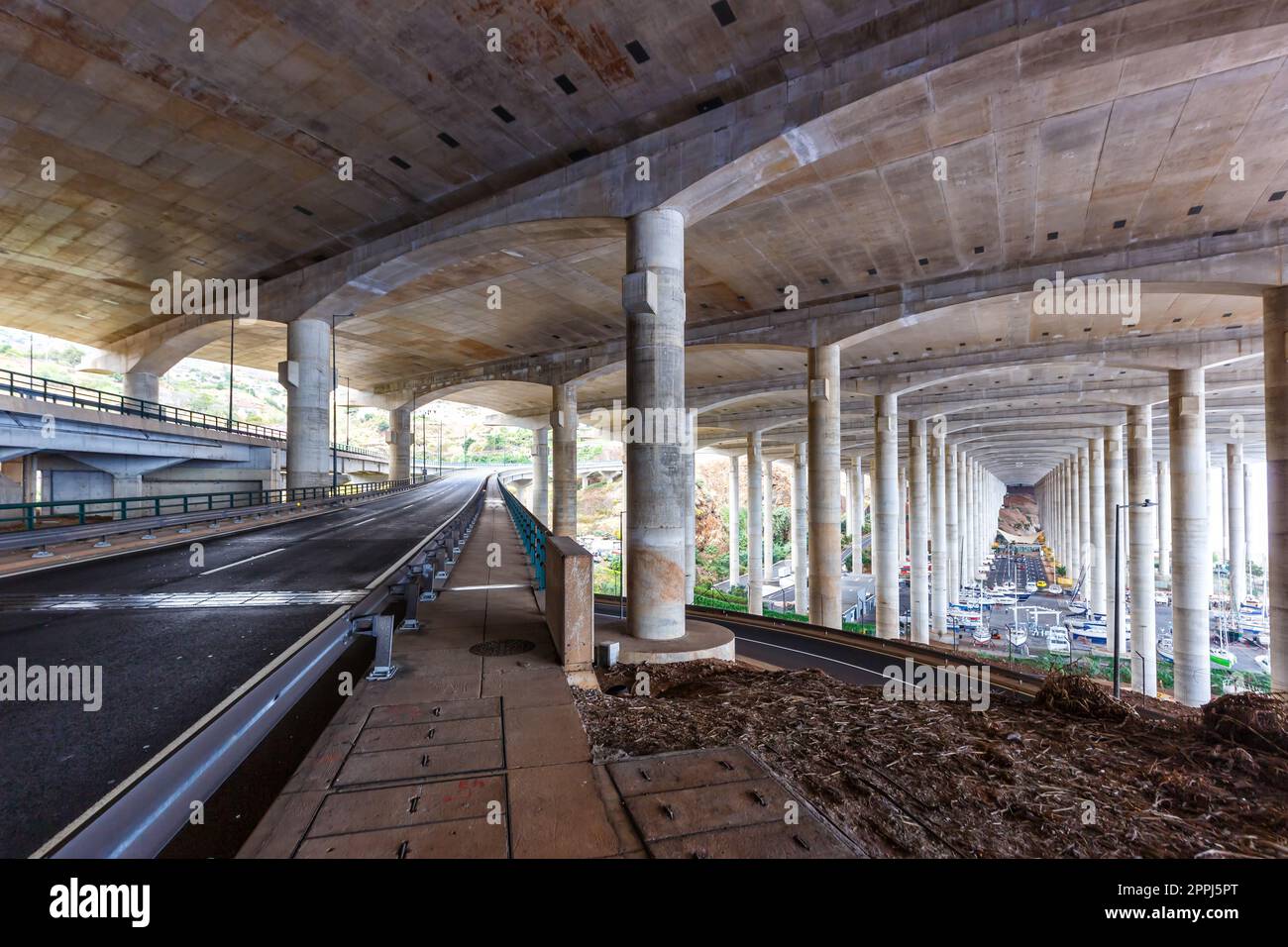 Concrete stilts construction under the runway of Funchal Madeira Cristiano Ronaldo Airport in Portugal Stock Photo