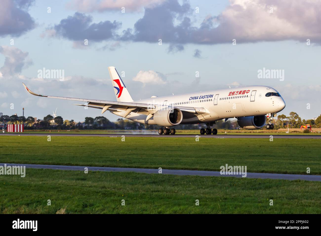 China Eastern Airbus A350-900 airplane at Amsterdam Schiphol airport in the Netherlands Stock Photo
