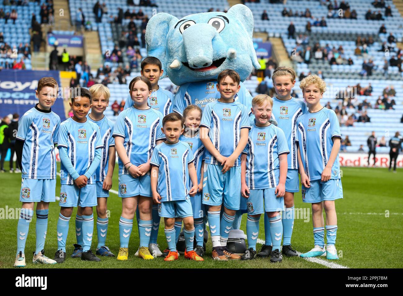 Coventry City match day mascots pose with Sky Blue Sam during the Sky