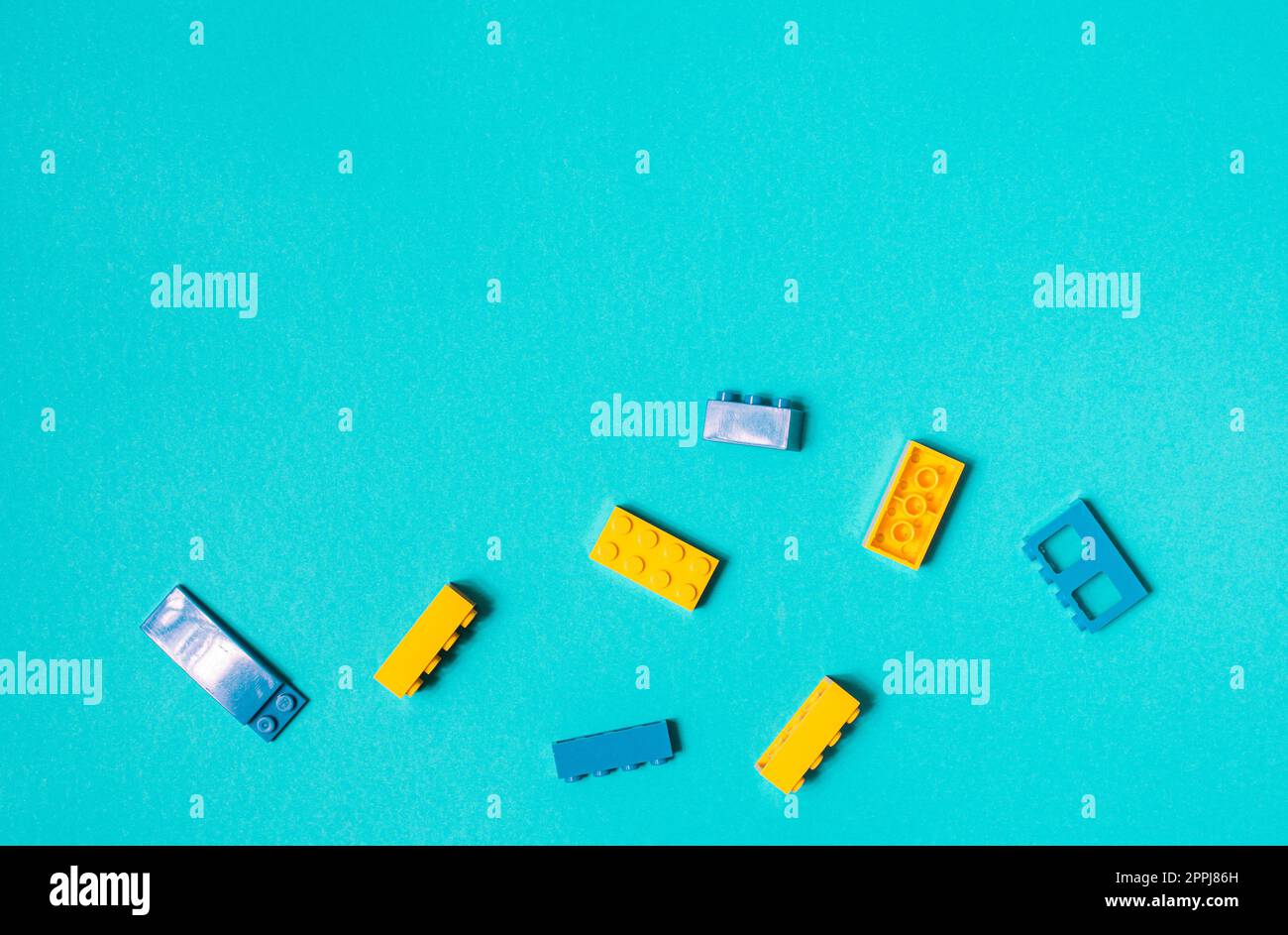 Constructor children plastic multi-colored on a pastel blue Stock Photo