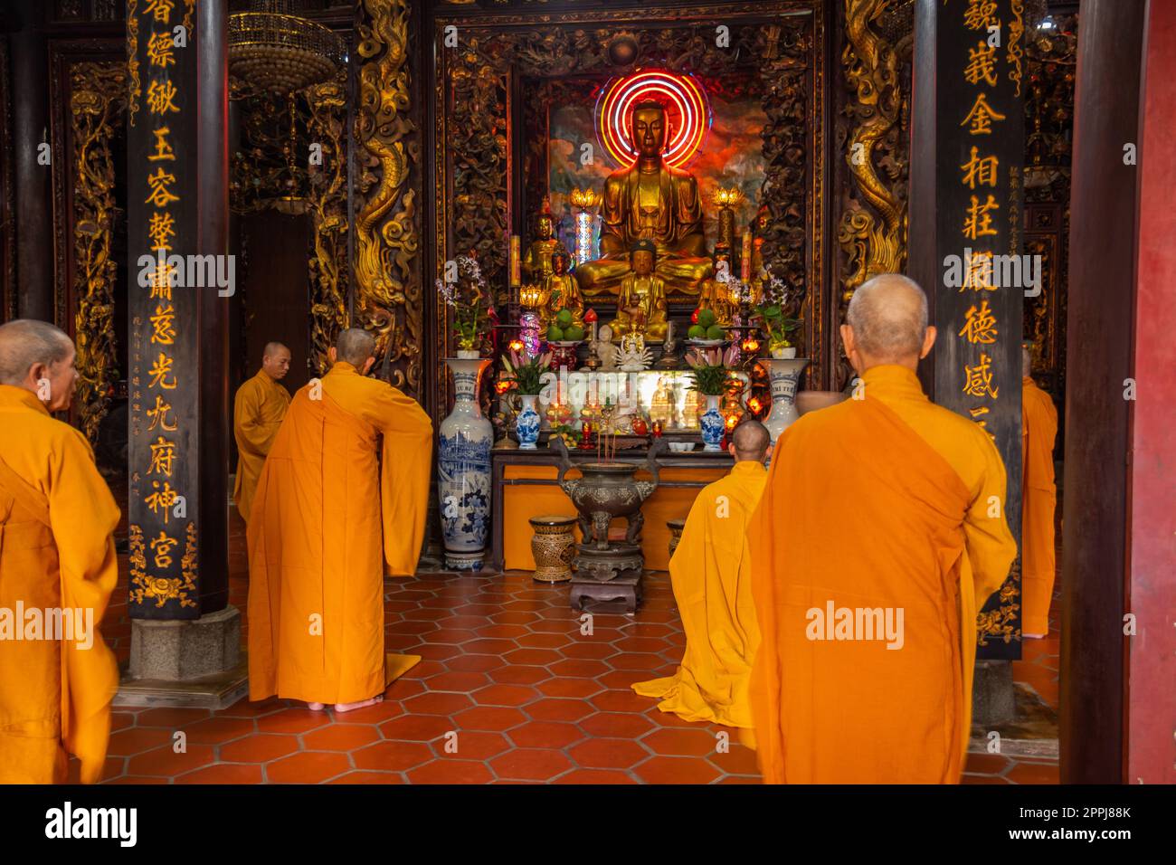 Buddhist monks pray in the temple Stock Photo Alamy