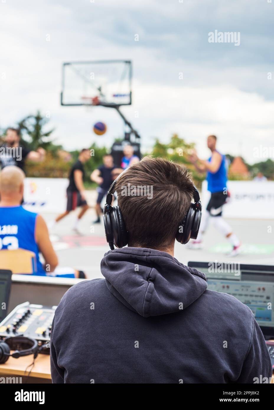 Reporter at basketball match Stock Photo Alamy