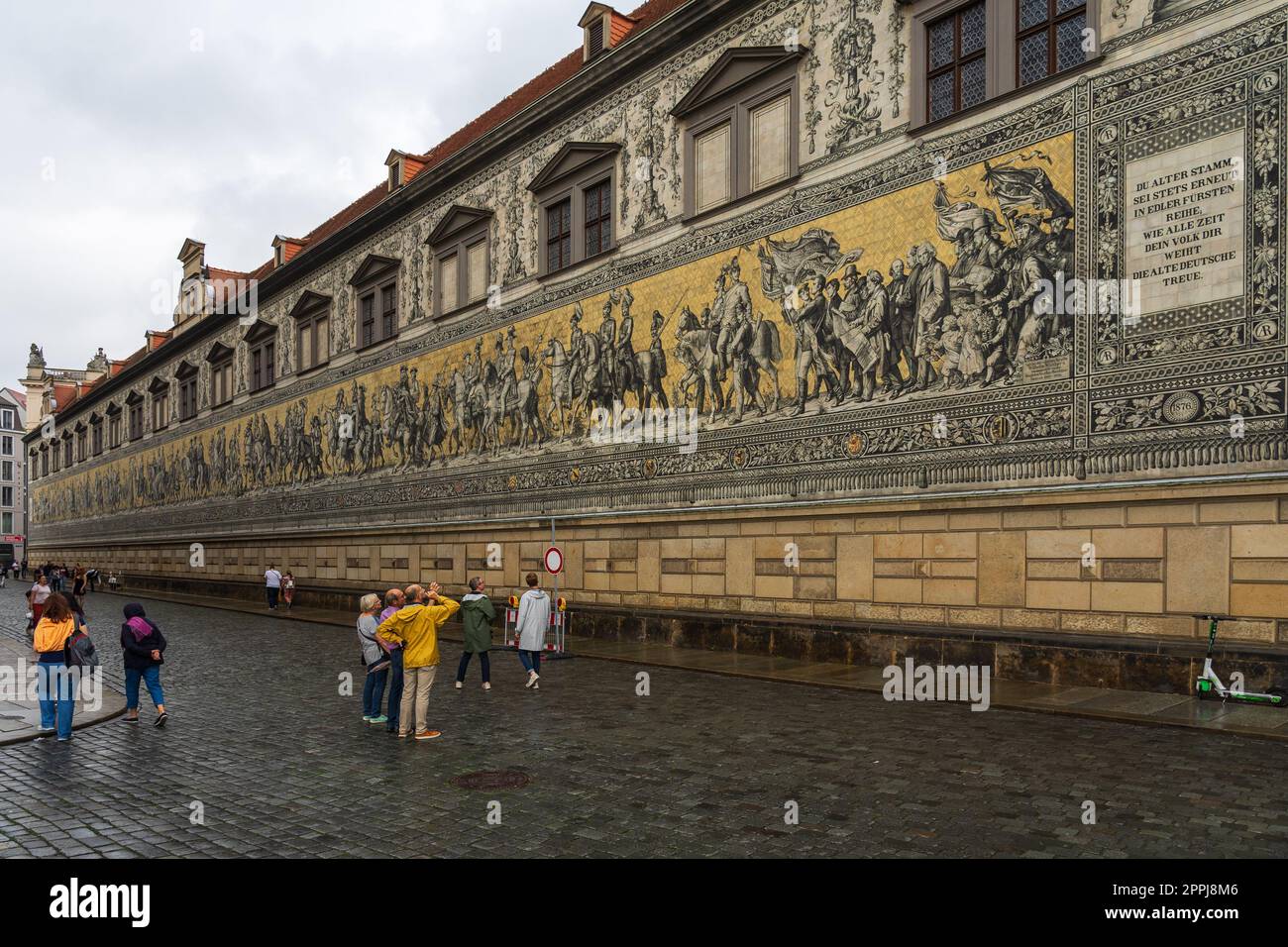 DRESDEN, GERMANY - AUGUST 27, 2022: The Fuerstenzug (Procession of Princes) on Augustusstrasse. Fuerstenzug is the famous Meissen porcelain wall tile panel. Stock Photo