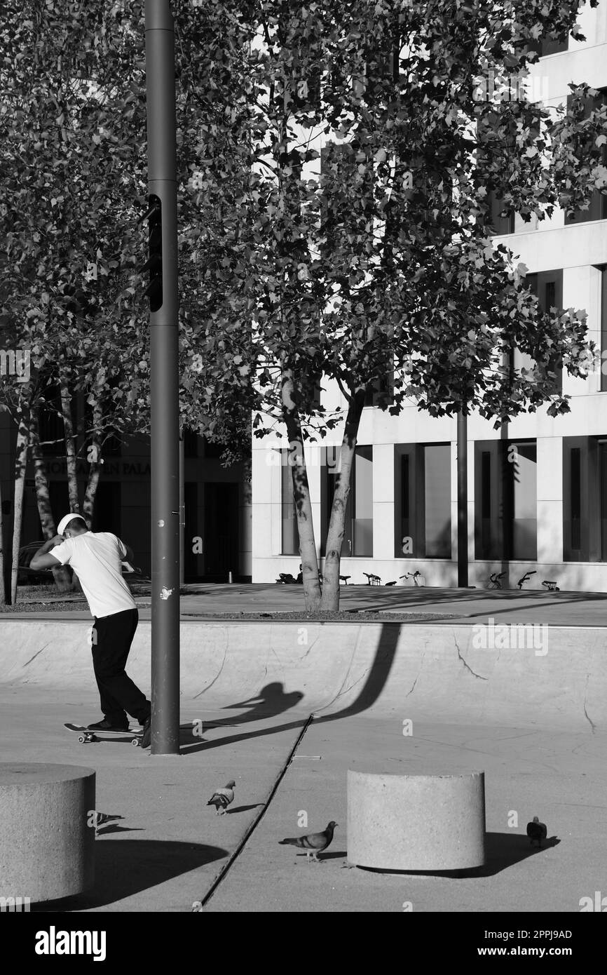 Skater in white shirt in front of the theater in Dsseldorf, Germany Stock Photo