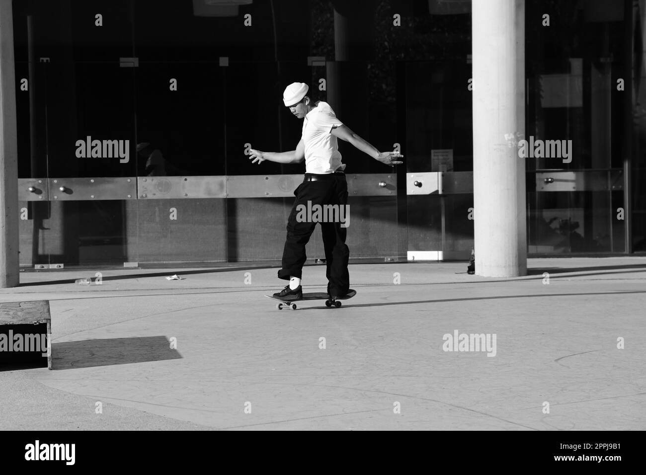 Skater in white shirt in front of the theater in Dusseldorf, Germany Stock Photo