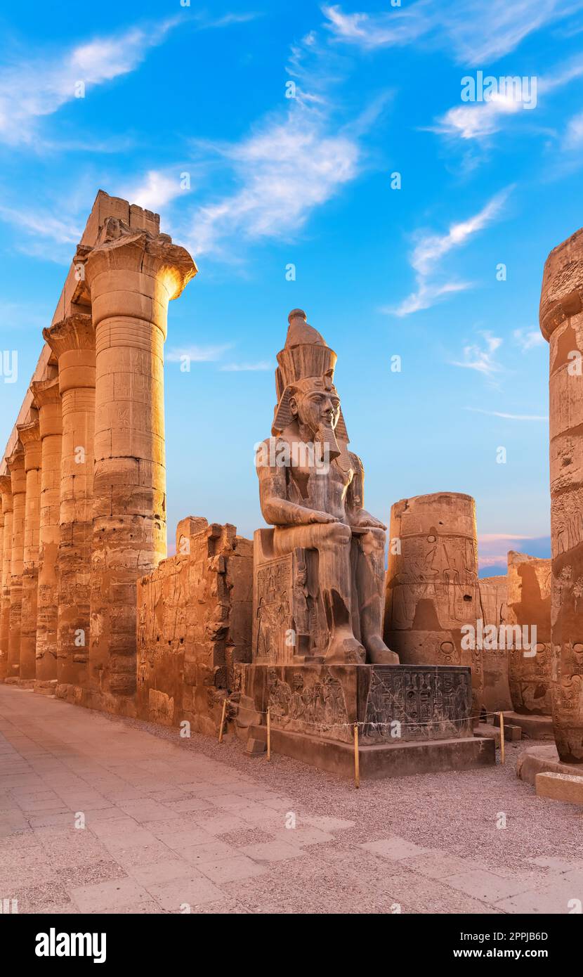 Seated statue of Ramesses II by the First pylon of the Luxor Temple, Egypt Stock Photo