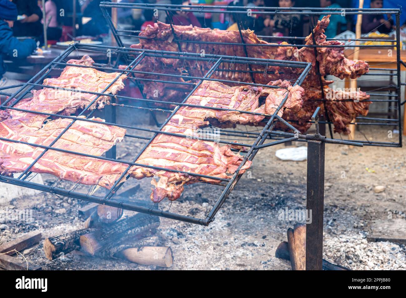 grilling pig on a spit, street food Stock Photo