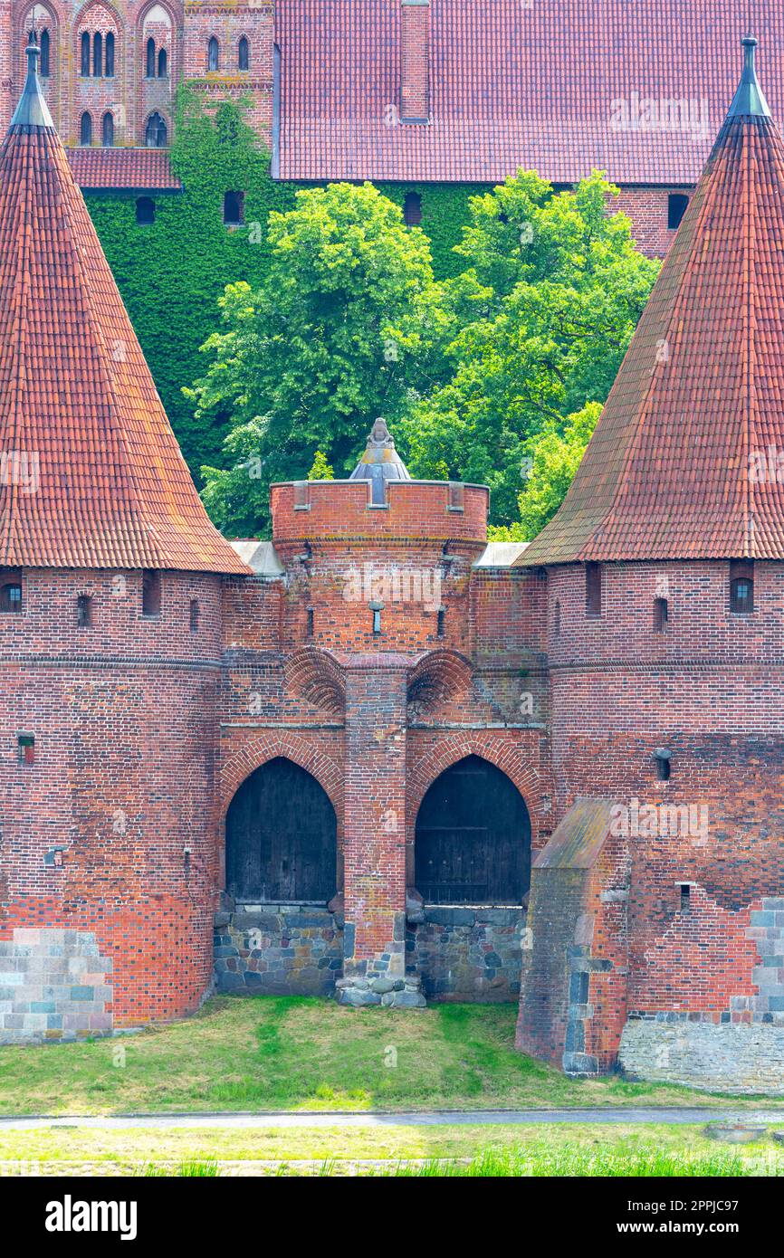 Malbork, Poland - June 25, 2020: 13th century Malbork Castle, medieval Teutonic fortress on the Nogat River.  It is the largest castle in the world, UNESCO World Heritage Site Stock Photo