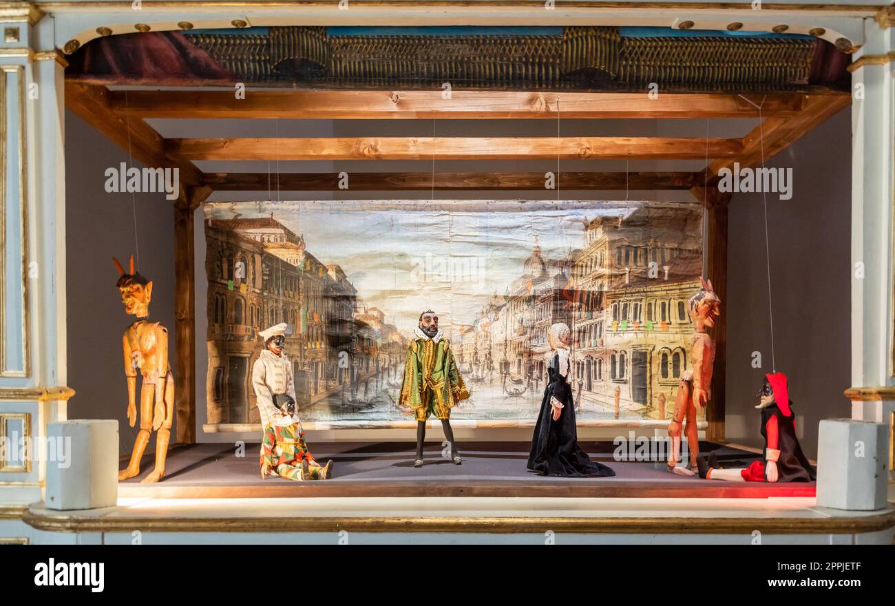 Vintage puppet show theatre made of wood. Old historical puppets. Stock Photo