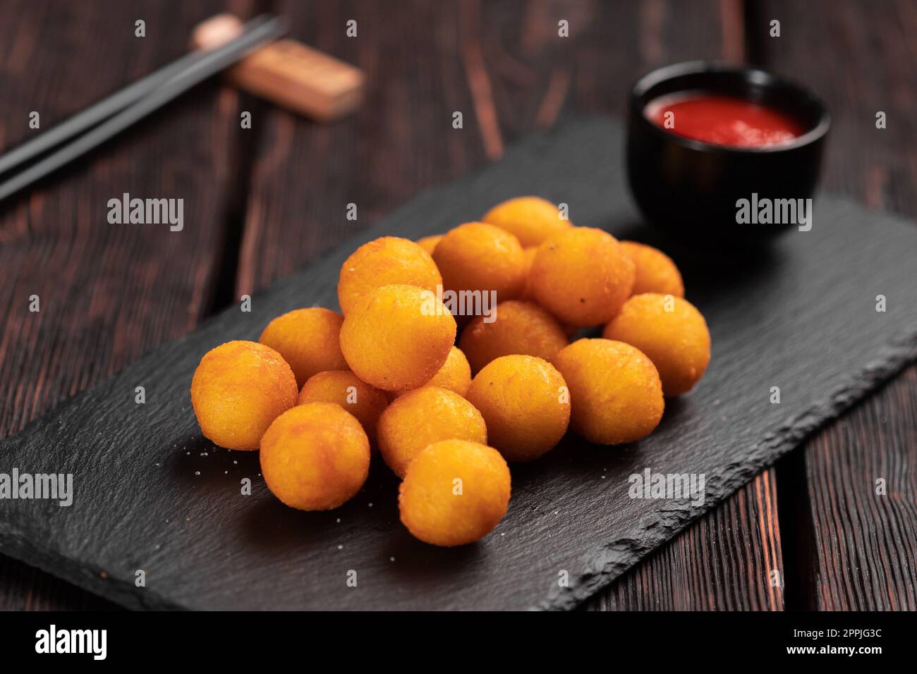 fish balls in batter with chopsticks - asian food top view Stock Photo