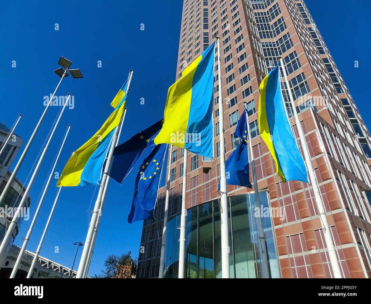 Frankfurt, Germany - April 24, 2022: Euro flag in Frankfurt and Ukrainian flag Stock Photo