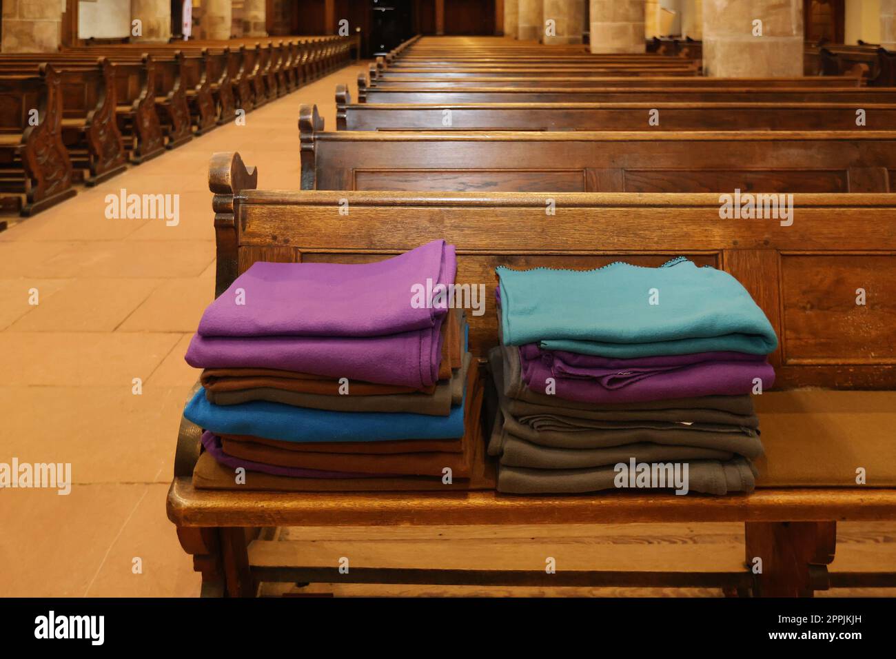 wool blankets on church pews Stock Photo