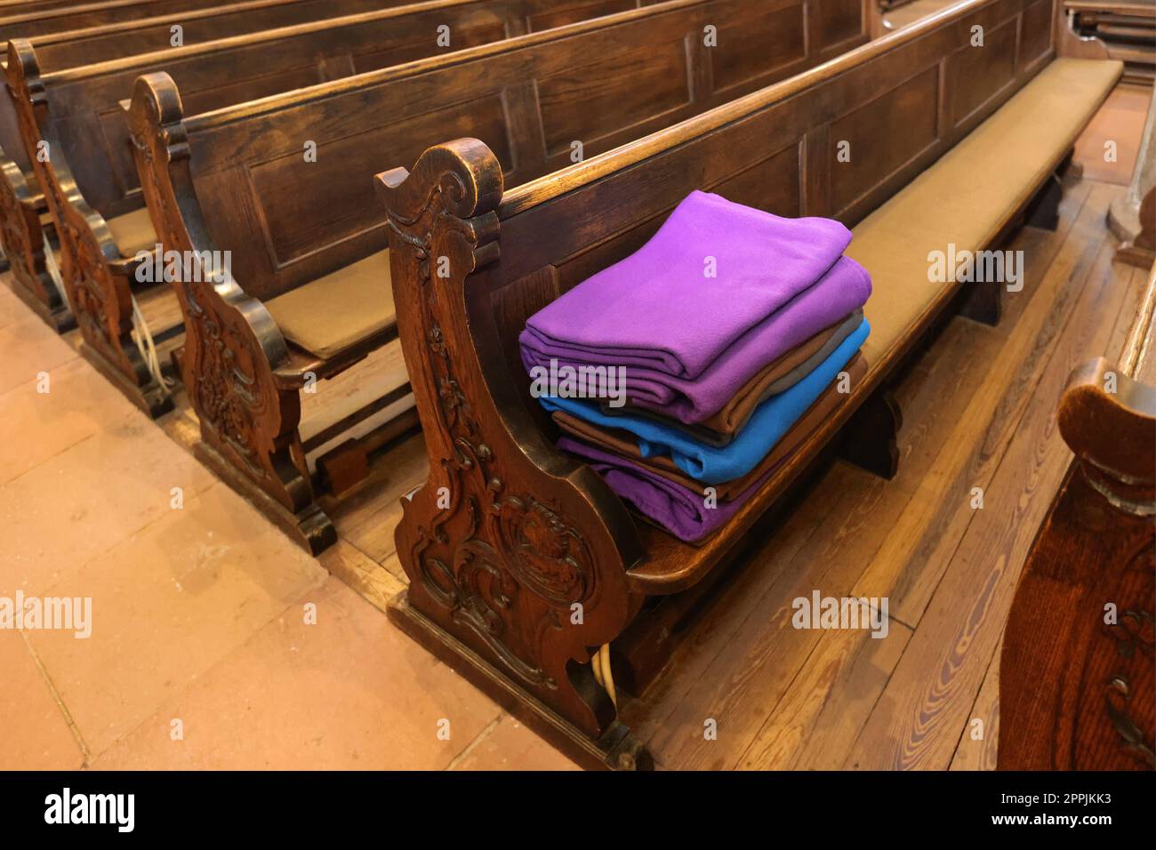 wool blankets on church pews Stock Photo