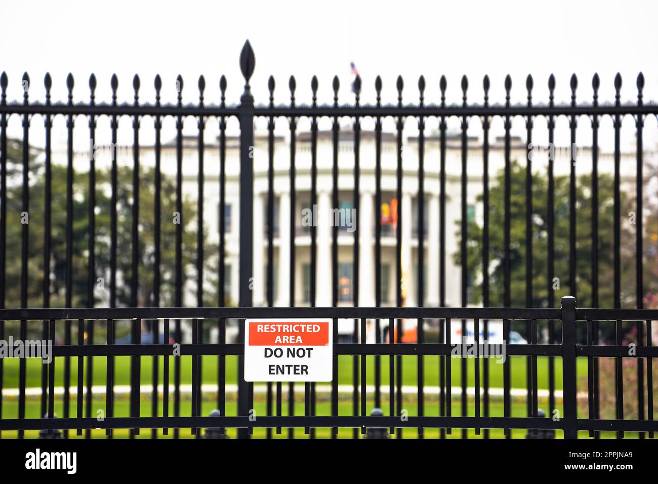 White House back garden iron fence and security warning view Stock Photo