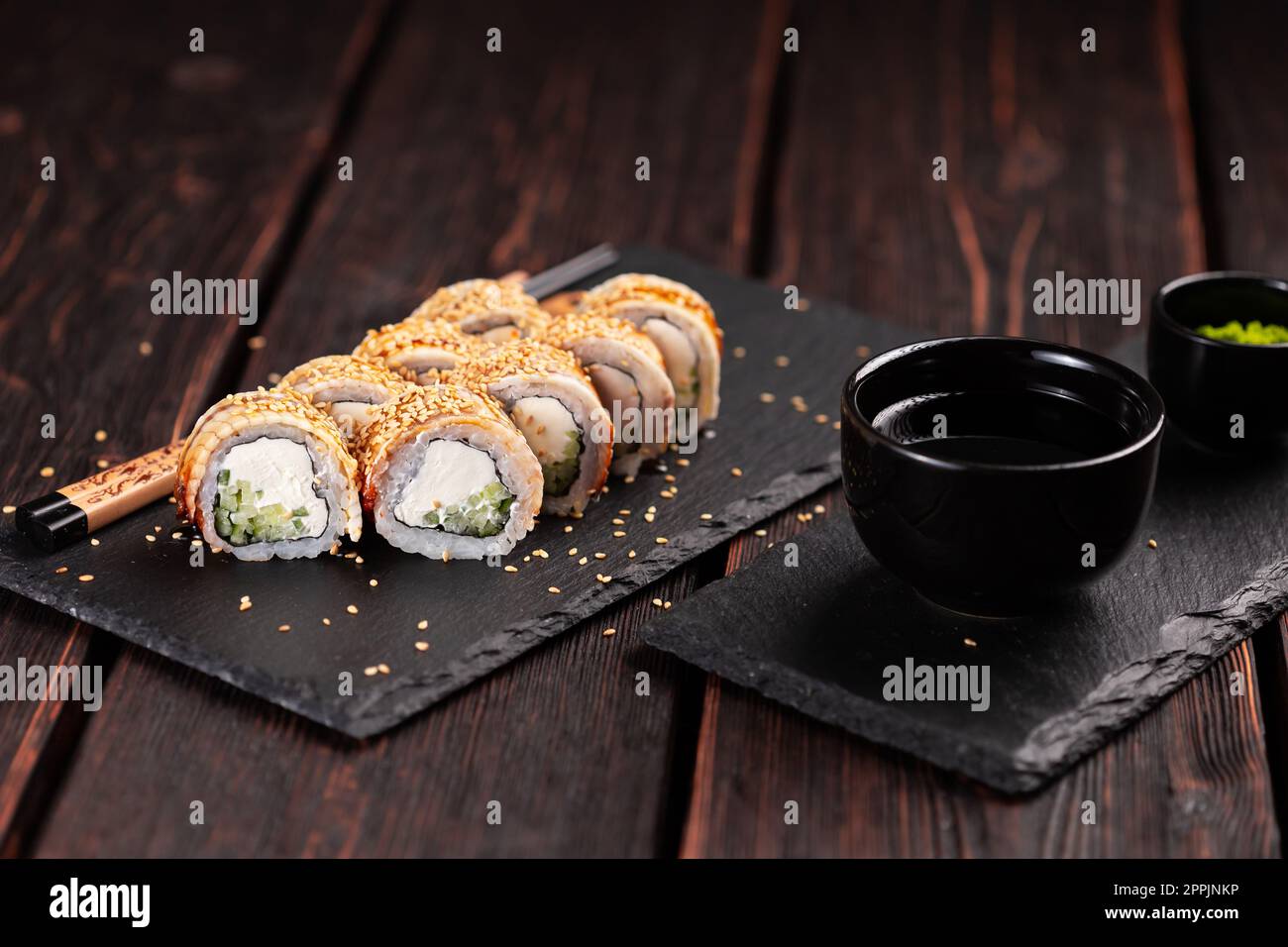 Premium Photo  Japanese food sushi rolls with eel and cream cheese topped  with unagi sauce