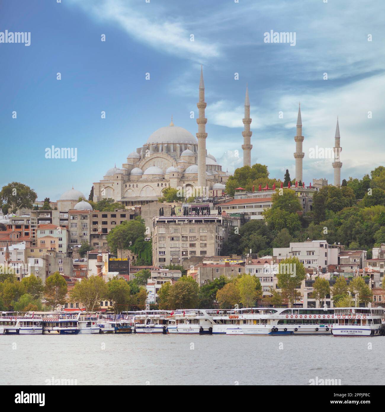 City view from Karakoy overlooking Golden Horn with docked ferry boats, and Suleymaniye Mosque, Istanbul, Turkey Stock Photo