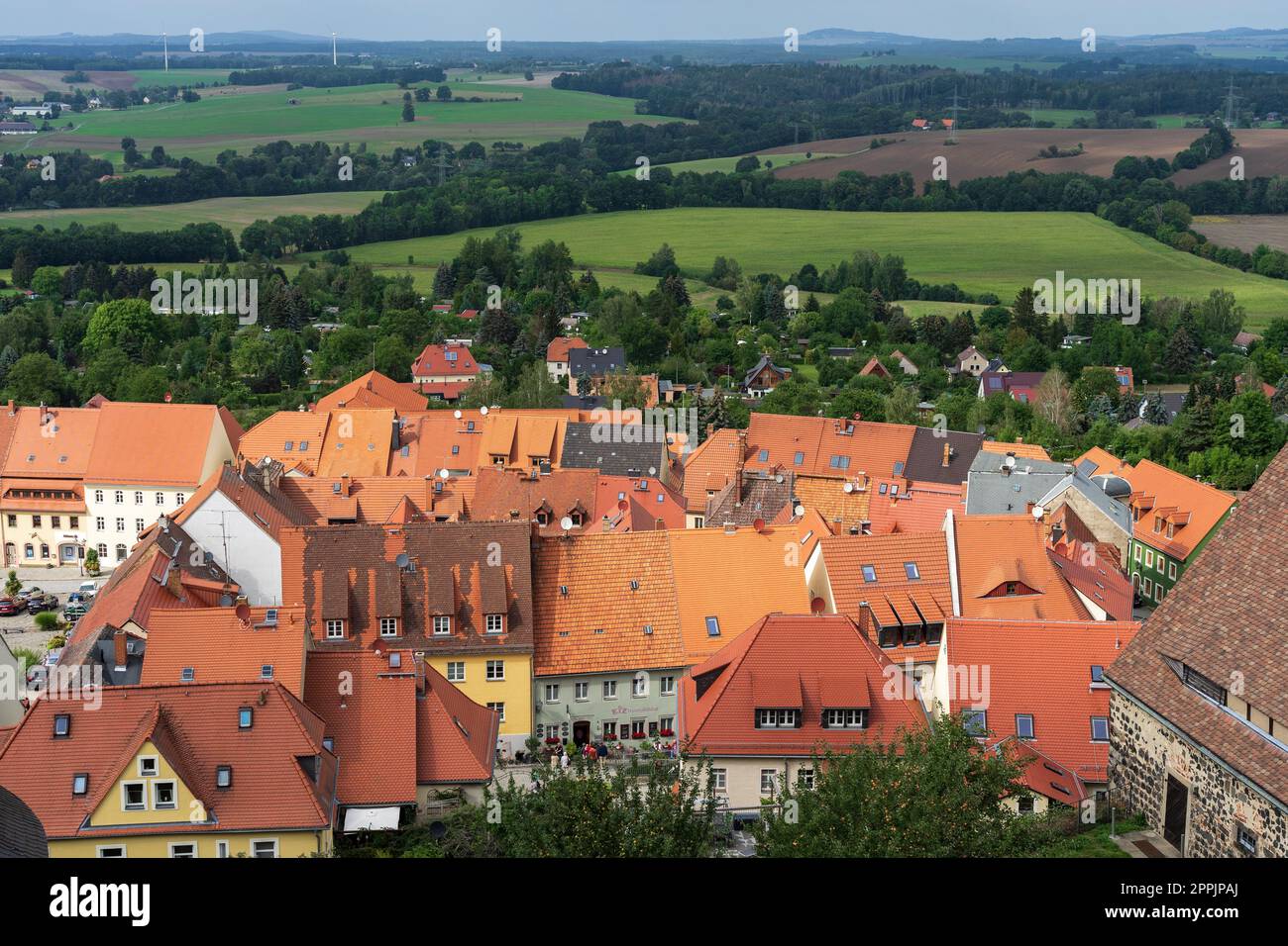 BURG STOLPEN, GERMANY - AUGUST 28, 2022: View of the city from the height of the watchtower of a medieval fortress on a basalt mountain. Saxony. Stock Photo