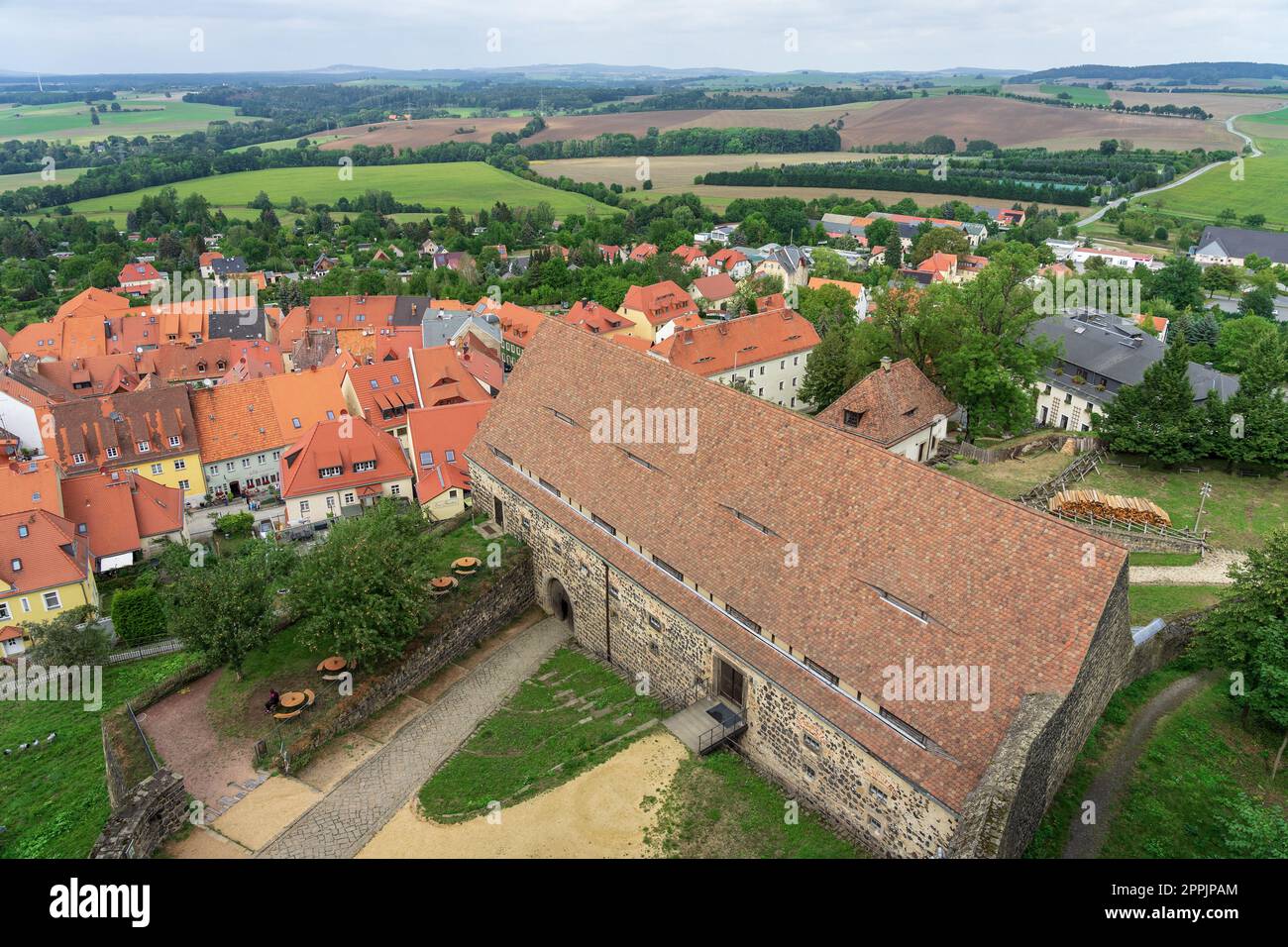 BURG STOLPEN, GERMANY - AUGUST 28, 2022: View of the city from the height of the watchtower of a medieval fortress on a basalt mountain. Saxony. Stock Photo