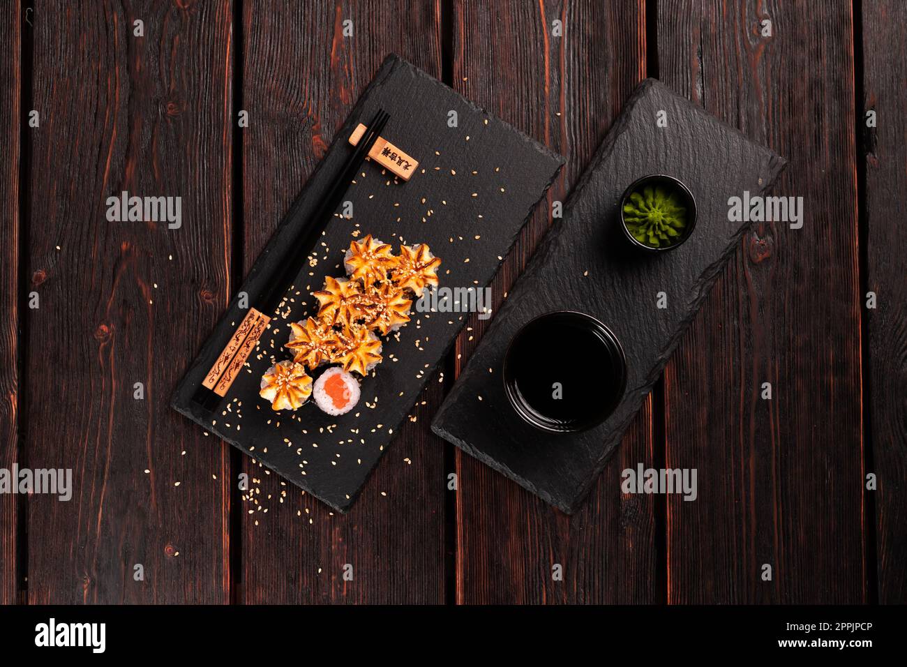 Japanese hot maki roll sushi with salmon top view - asian food concept Stock Photo