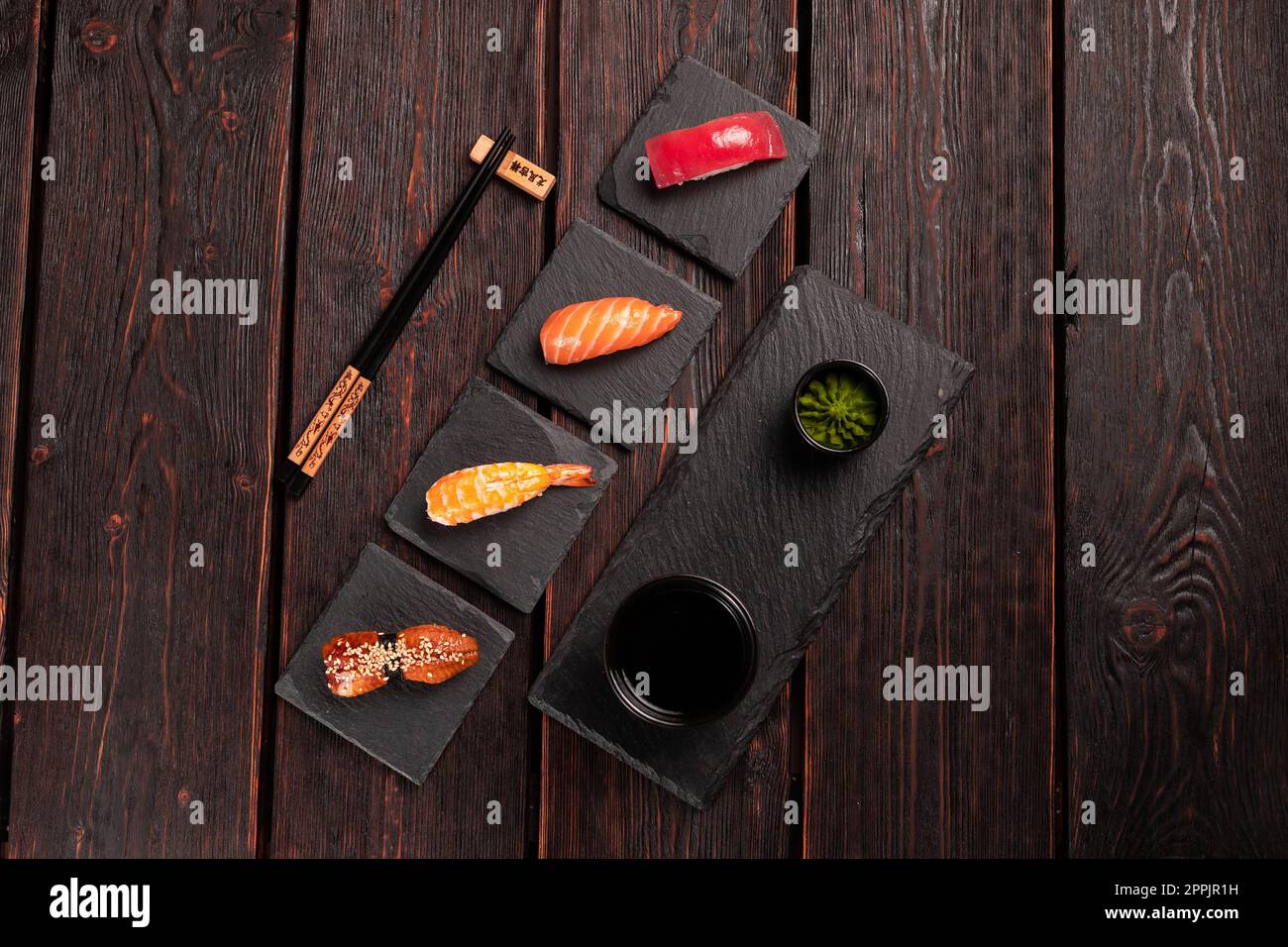 Delicious Sushi Nigiri on wooden background. Traditional Japanese cuisine Stock Photo
