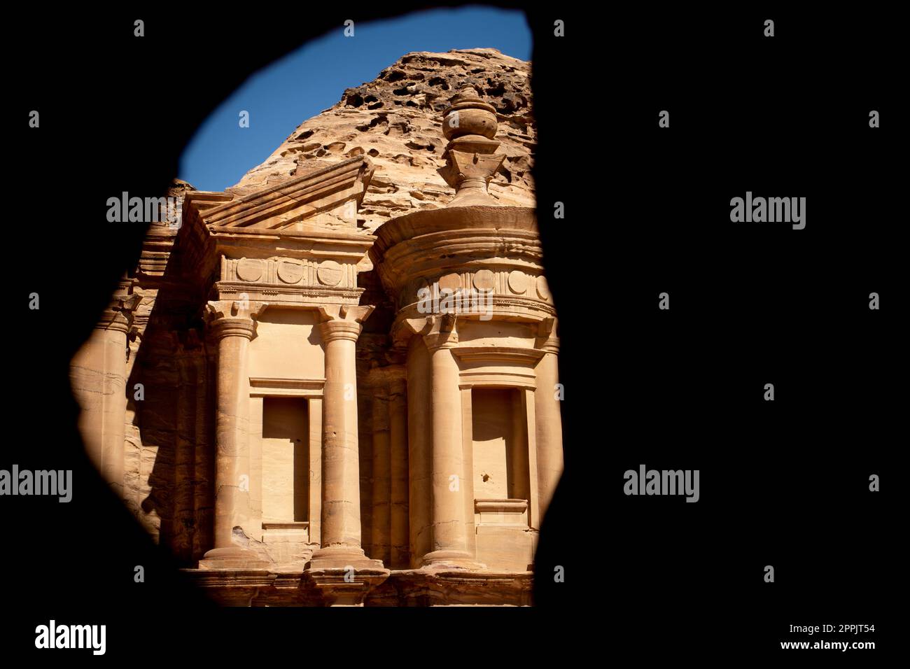 Cave view on the Monastery (ad deir) in Petra, Jordan. Stock Photo
