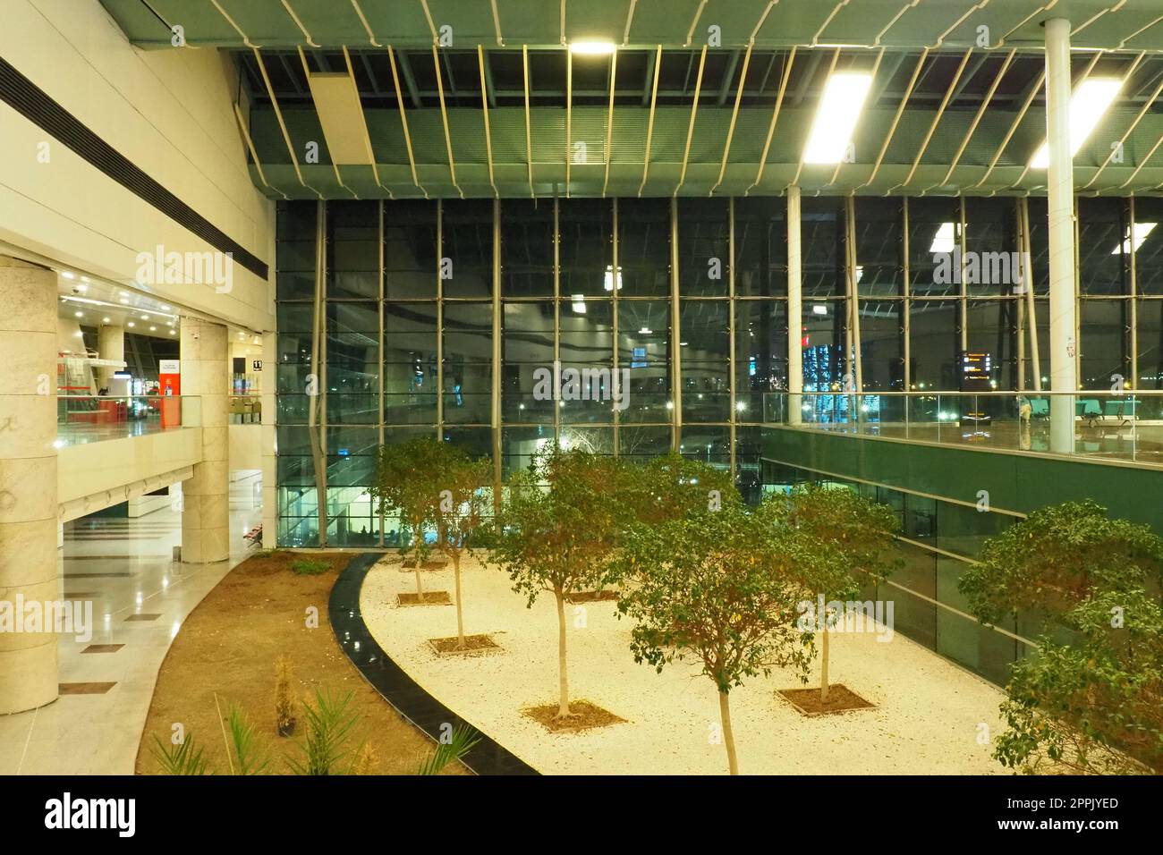 Ankara, Turkiye, Esenboga Havalimani Airport, 01.18.2023 lobby or corridor at the airport for the transit of passengers who have passed check-in. Airport interior. Shops, cafes and trees. Turkey Stock Photo
