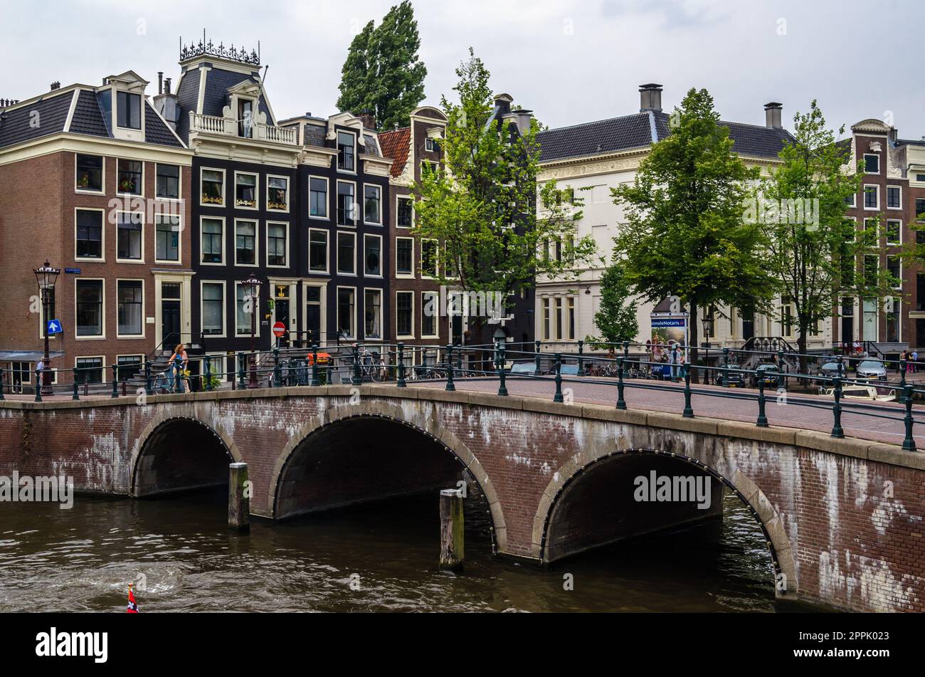 AMSTERDAM, THE NETHERLANDS - AUGUST 24, 2013: Urban landscape in Amsterdam, the Netherlands, view of streets and canals in the famous Canal District, designated as a UNESCO World Heritage Site Stock Photo
