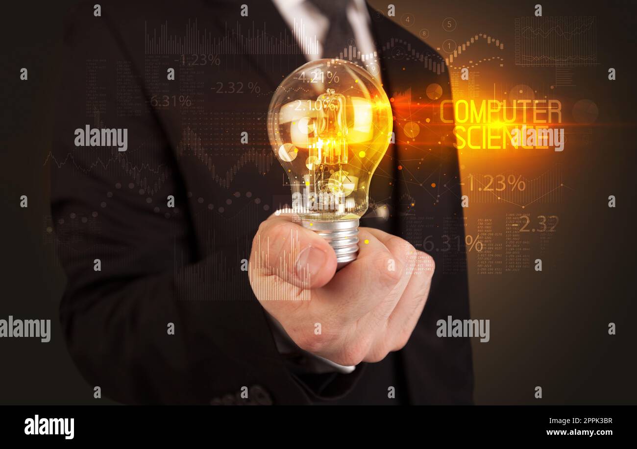 Businessman holding a lightbulb concept Stock Photo - Alamy
