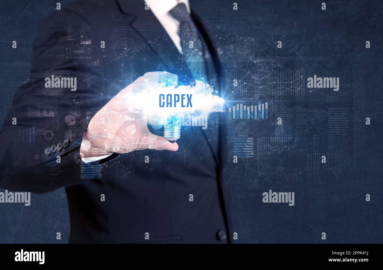 Businessman holding a light bulb, business concept Stock Photo - Alamy