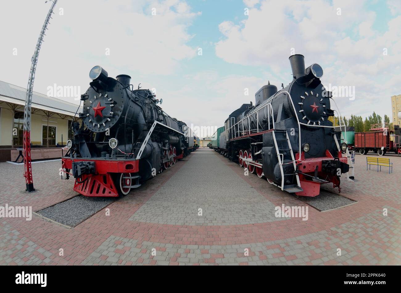 Photo of old black steam locomotives of the Soviet Union. Strong distortion from the fisheye lens Stock Photo